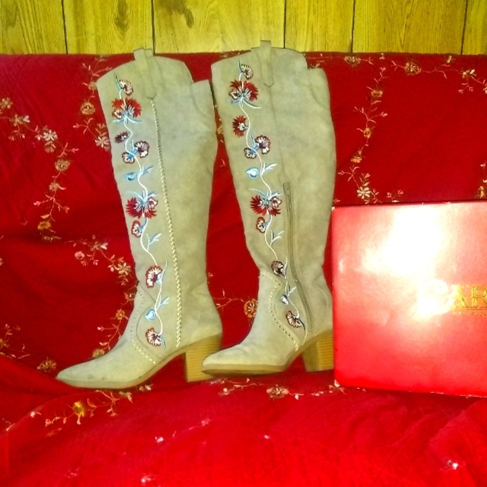 Over the knee Carlos Santana boots.